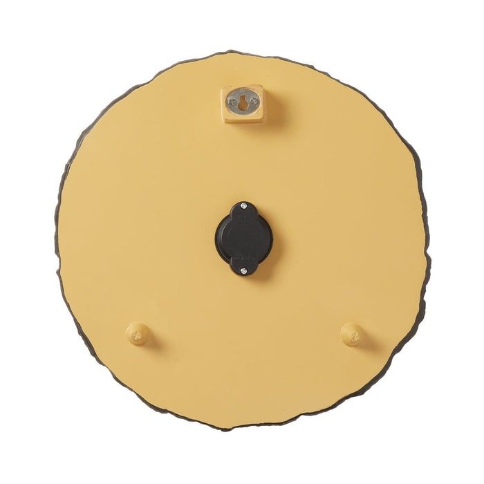 Back view of a round yellow tree trunk cross section thermometer showing mounting block and two pegs