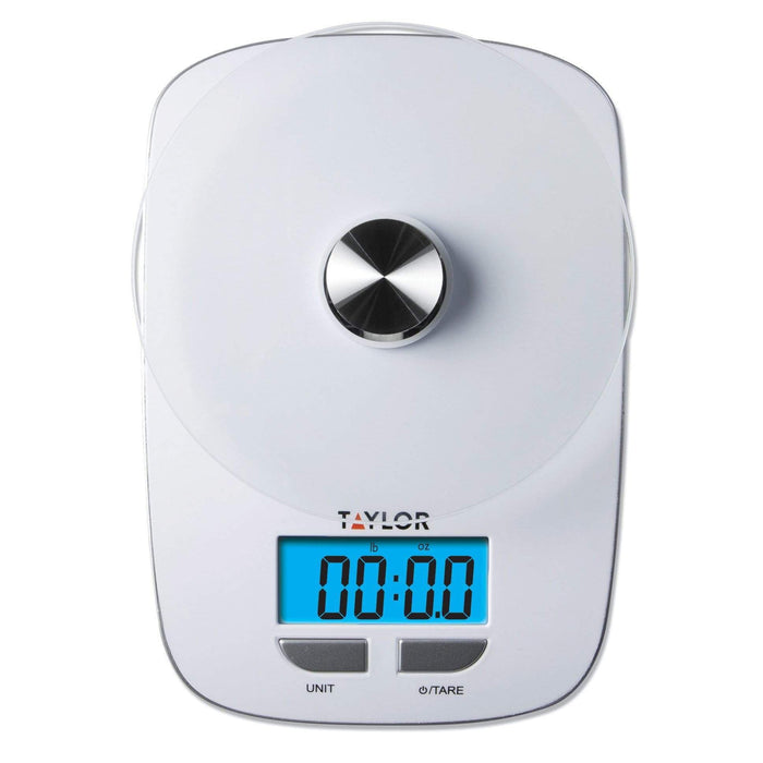 Glass platform digital kitchen scale close-up with a circular metal knob and blue digital display.